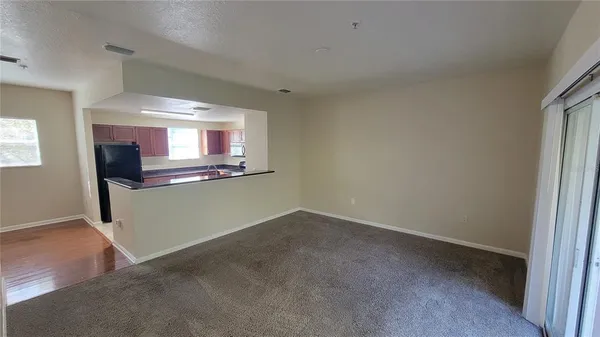 a view of a kitchen with a sink and a window