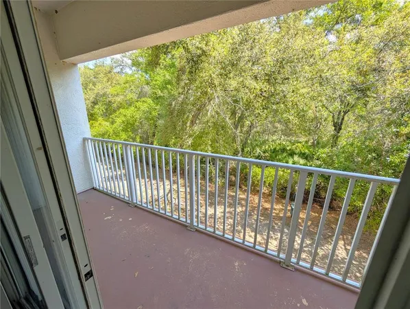 a view of balcony with wooden floor