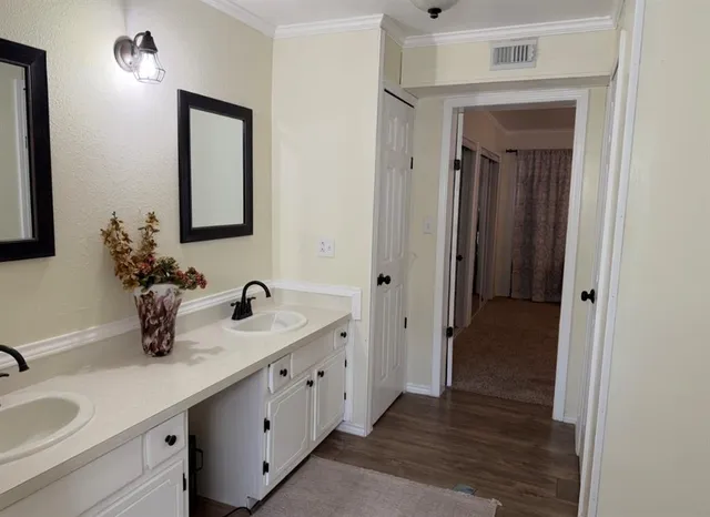 a bathroom with sink and mirror