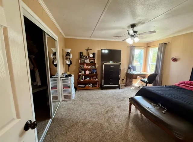 a view of a livingroom with furniture and a flat screen tv