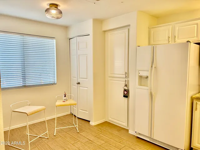 a bathroom with a window and a shower