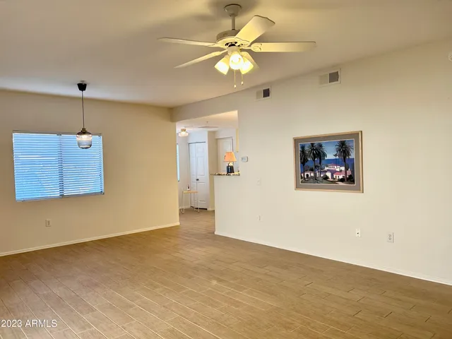 a view of empty room with windows