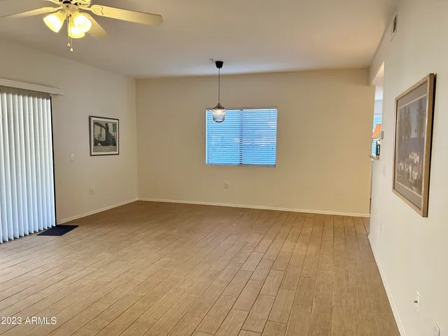 a view of empty room with a ceiling fan
