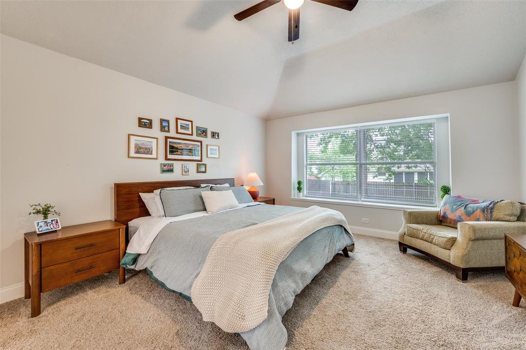 7306 Vista Ridge Lane Sachse, TX 75048 - Photo 12 of 23 a spacious bedroom with a bed and a couch