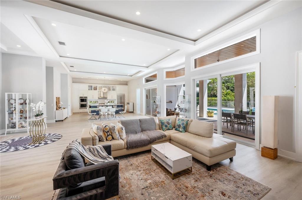 9240 The Lane Naples, FL 34109 - Photo 12 of 42 a living room with furniture and a table