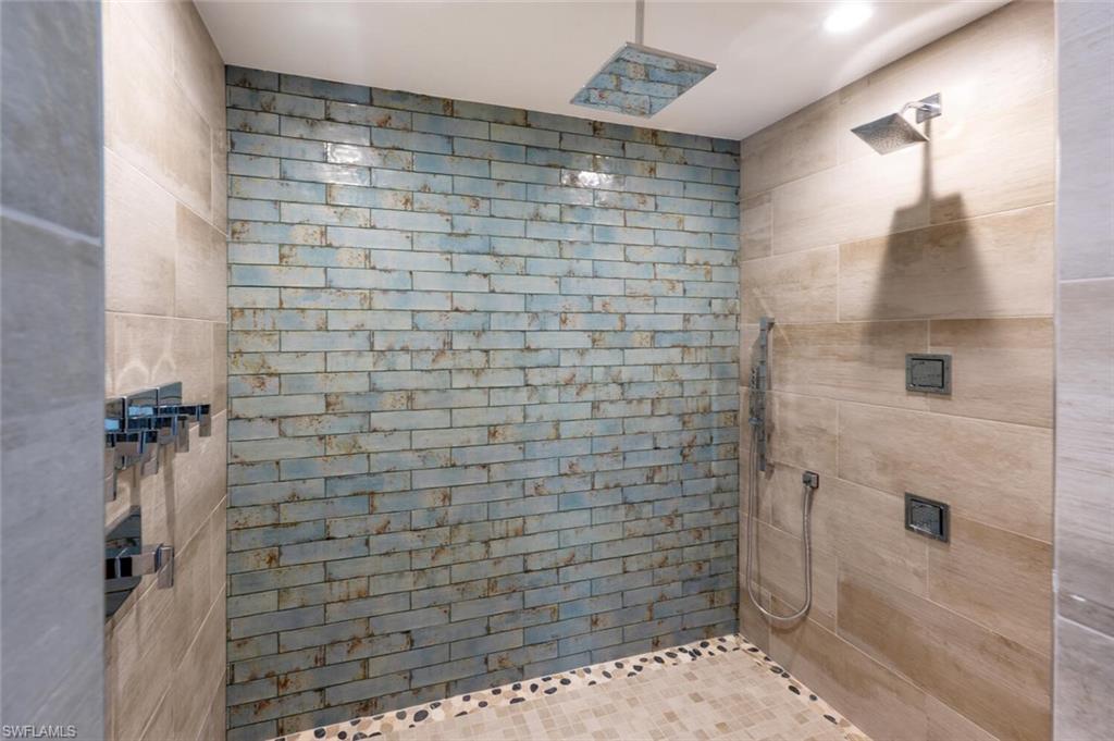 9240 The Lane Naples, FL 34109 - Photo 24 of 42 a bathroom with a shower