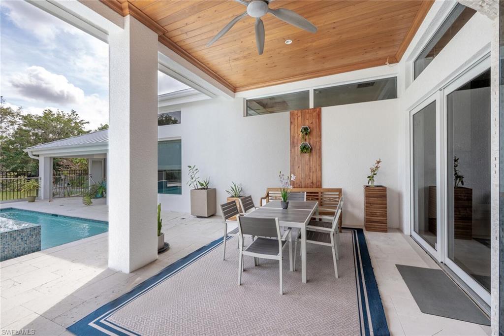 9240 The Lane Naples, FL 34109 - Photo 28 of 42 a outdoor space with chairs