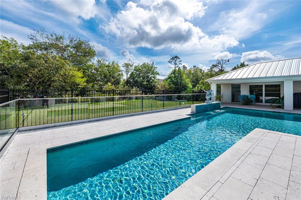 9240 The Lane Naples, FL 34109 - Photo 30 of 42 a view of a house with a yard