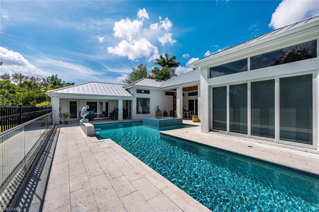 9240 The Lane Naples, FL 34109 - Photo 33 of 42 a view of a house with backyard and porch