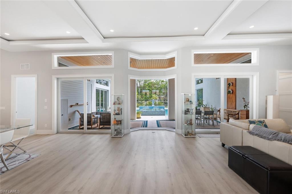 9240 The Lane Naples, FL 34109 - Photo 5 of 42 a living room with furniture and a large window