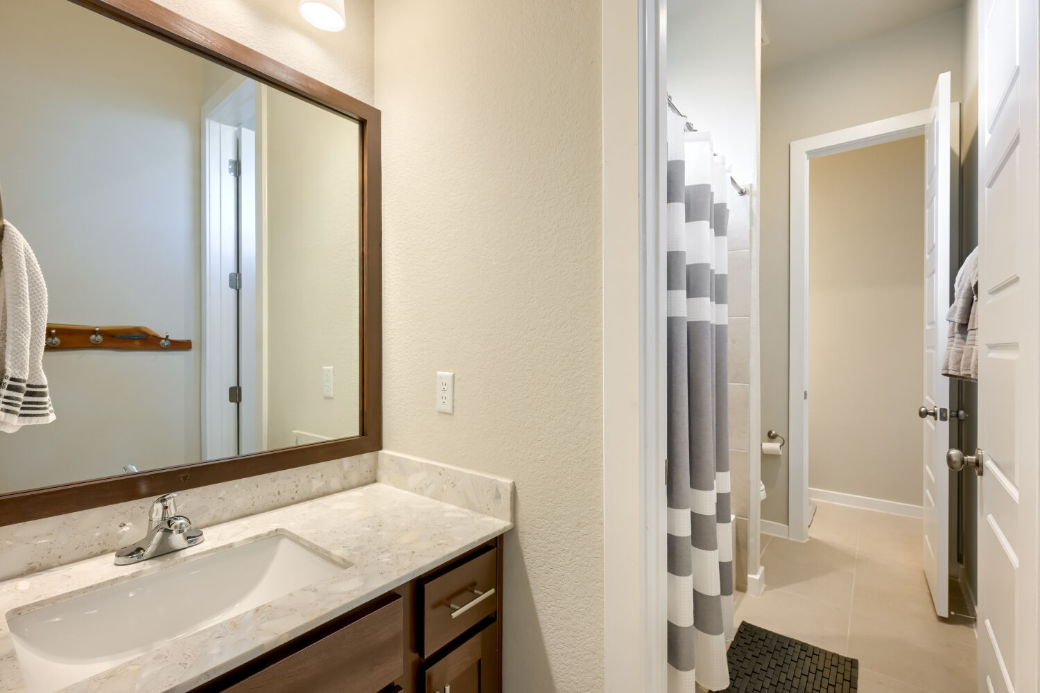 621 Rancho Sienna Loop Georgetown, TX 78628 - Photo 21 of 28 A refined bathroom featuring a contemporary vanity with a spacious basin and elegant stone counters.