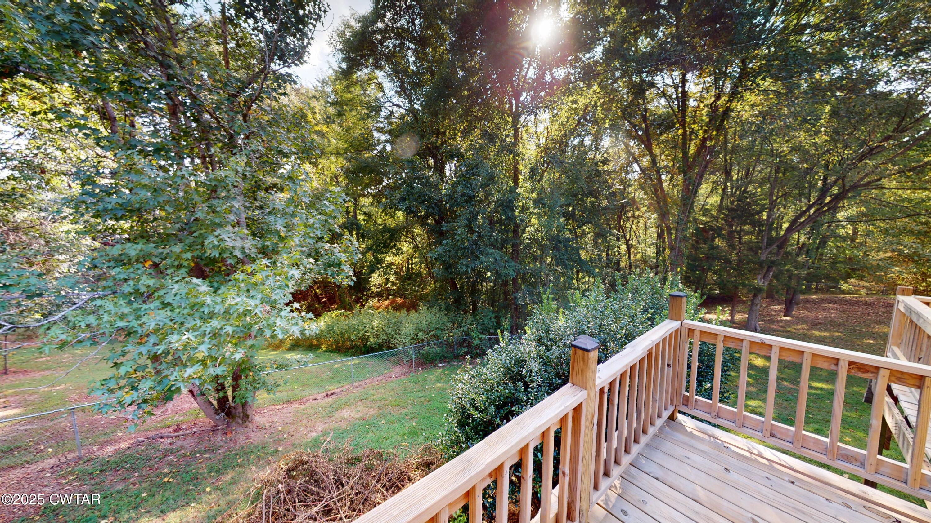 328 Cates Road Halls, TN 38040 - Photo 26 of 35 a balcony with wooden fence and trees