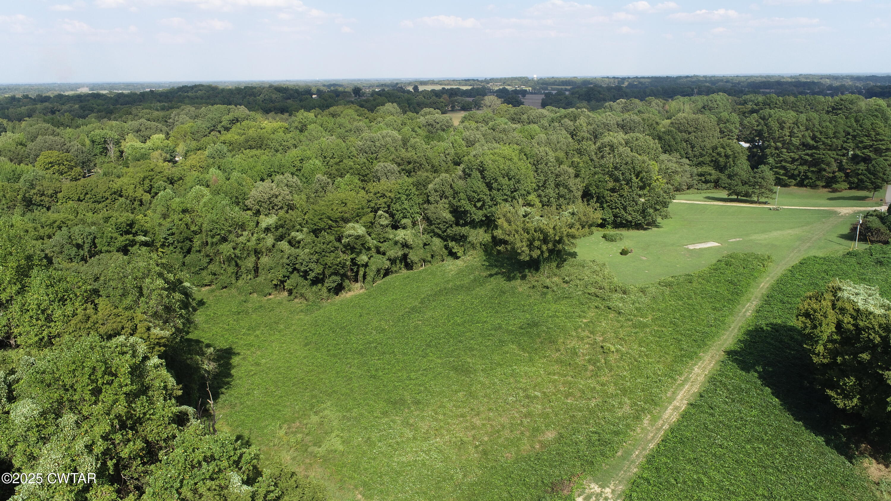 328 Cates Road Halls, TN 38040 - Photo 30 of 35 a view of a lush green outdoor space with a lake view