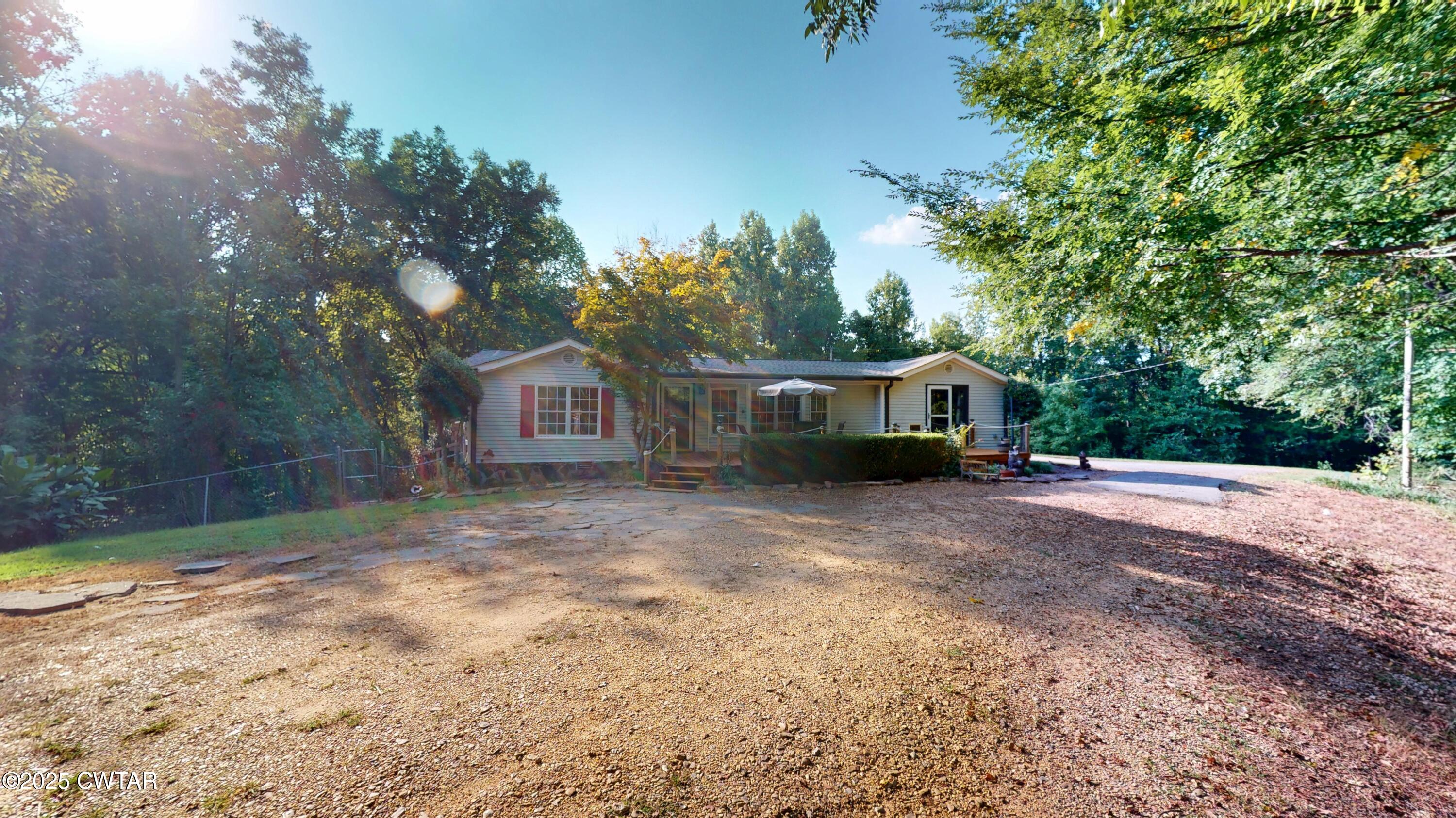 328 Cates Road Halls, TN 38040 - Photo 5 of 35 a view of a house with a yard and garage