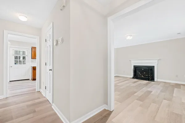 a view of a hallway with a fireplace