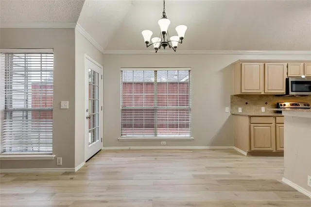 a view of a kitchen with granite countertop cabinets and window