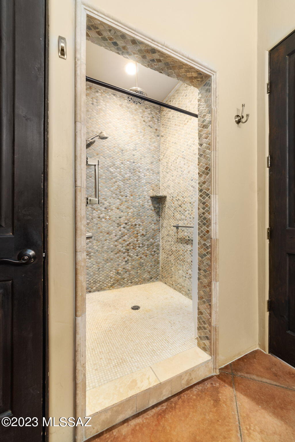 5670 Triangle X Place Tucson, AZ 85713 - Photo 11 of 36 a bathroom with a glass shower door