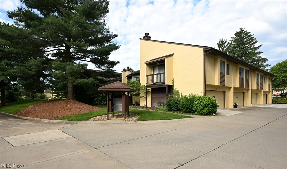 979 Hampton Ridge Drive Akron, OH 44313 - Photo 3 of 25 View of building exterior with a garage