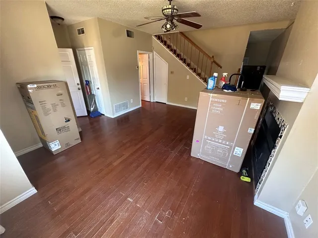 a view of a livingroom with wooden floor
