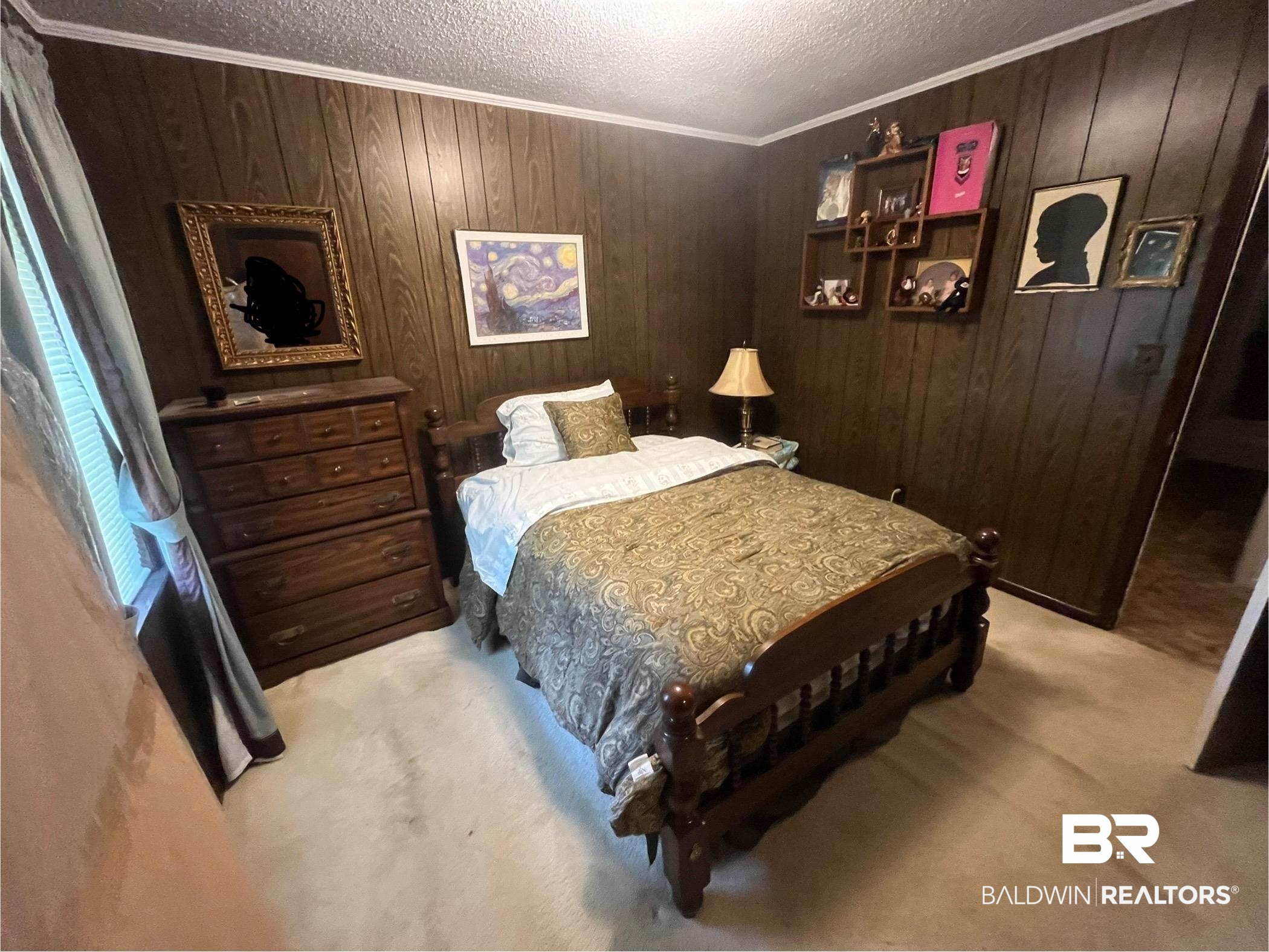 315 Dawkins Road Brewton, AL 36426 - Photo 18 of 19 Bedroom featuring carpet flooring, wood walls, a textured ceiling, and ornamental molding