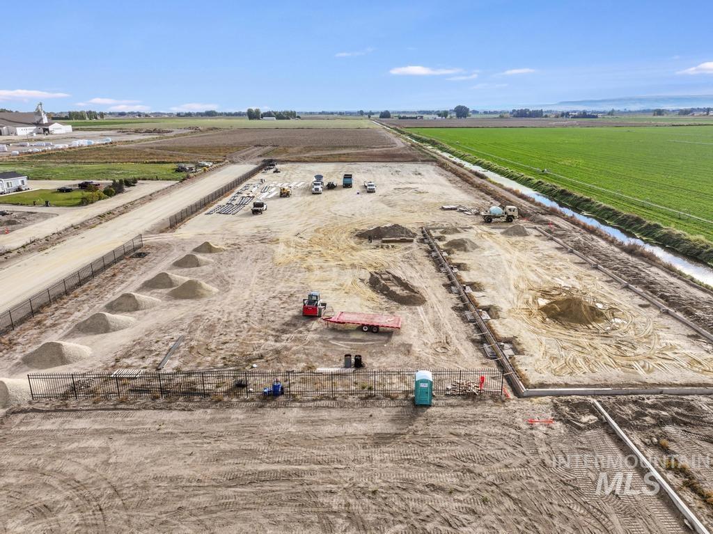 200 South 200 West Rupert, ID 83350 - Photo 4 of 25 Aerial view of sparsely populated area with rows of crops
