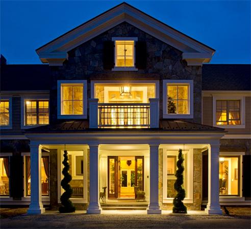 a front view of residential houses with a street