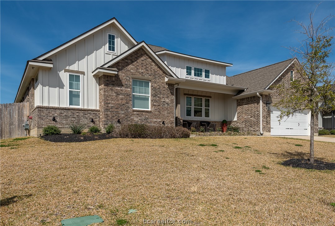3317 Stone Leigh Lane Bryan, TX 77808 - Photo 2 of 30 a front view of a house with a yard