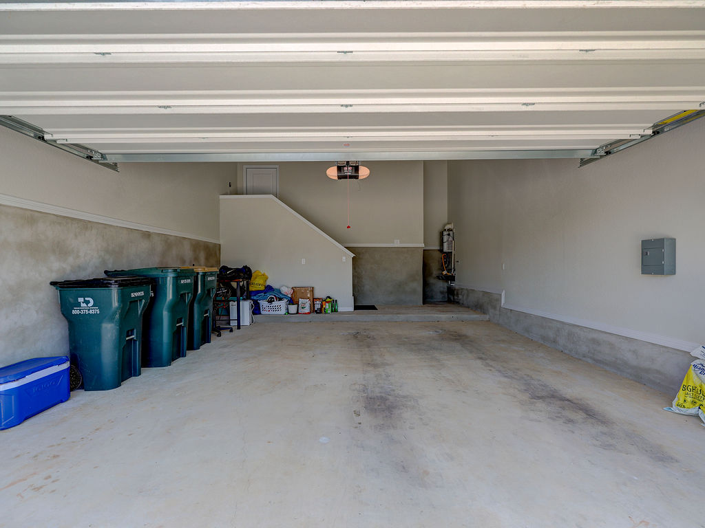 229 Heartleaf Road San Marcos, TX 78666 - Photo 38 of 40 A spacious, clean garage offers ample storage and direct access to the interior via a dedicated staircase.
