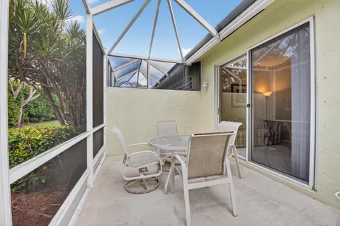 a view of a swimming pool with a patio