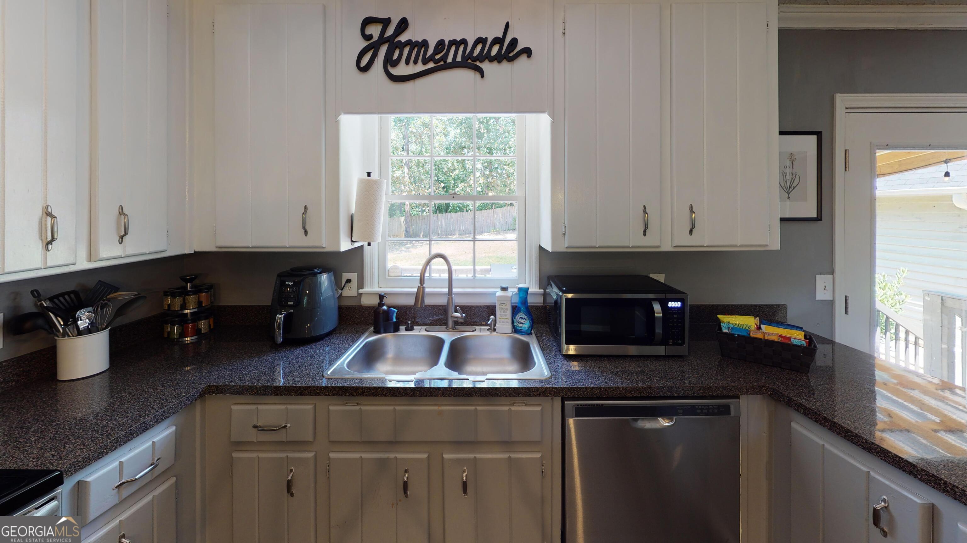 4297 Earney Road, Unit 1 Woodstock, GA 30188 - Photo 5 of 9 a kitchen with sink and cabinets