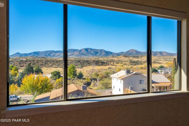 a view of a balcony with wooden floor
