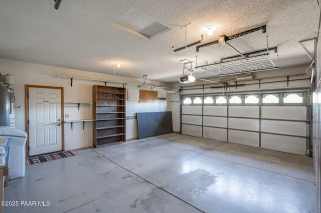 an aerial view of a house with yard swimming pool and outdoor seating