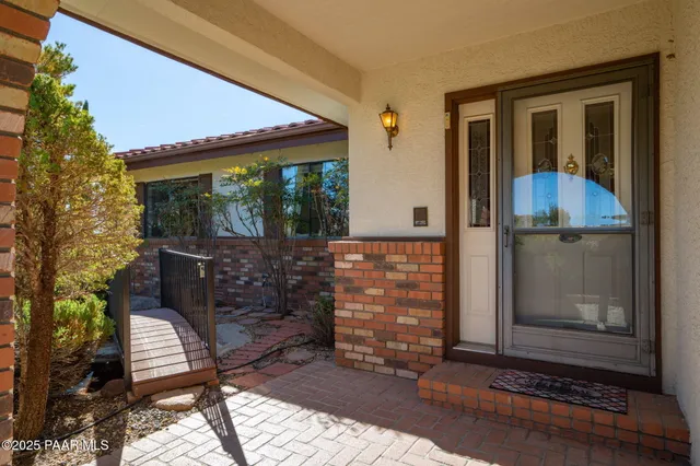 a kitchen with refrigerator and window