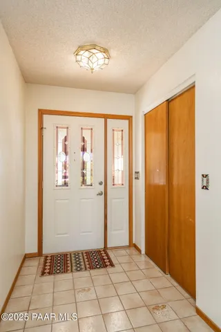 a view of a kitchen with a sink and chandelier kitchen view