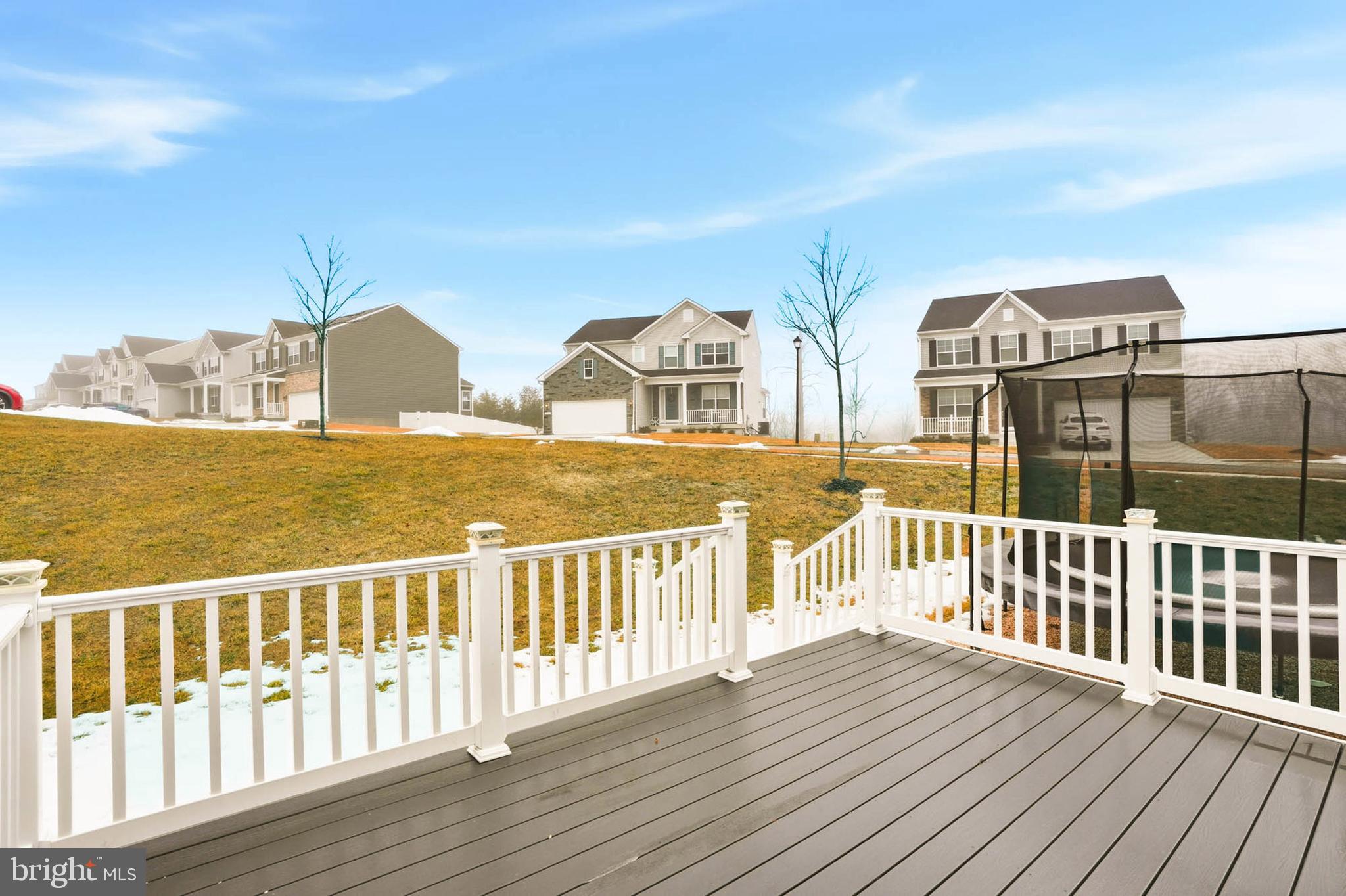 2305 Connor Circle Mount Airy, MD 21771 - Photo 12 of 44 a view of a brick house with wooden fence