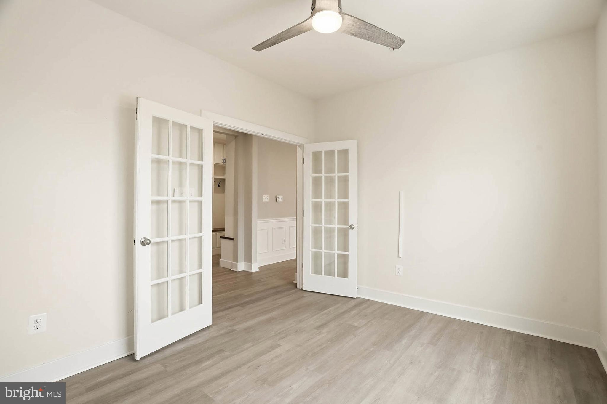 2305 Connor Circle Mount Airy, MD 21771 - Photo 17 of 44 an empty room with wooden floor closet and windows