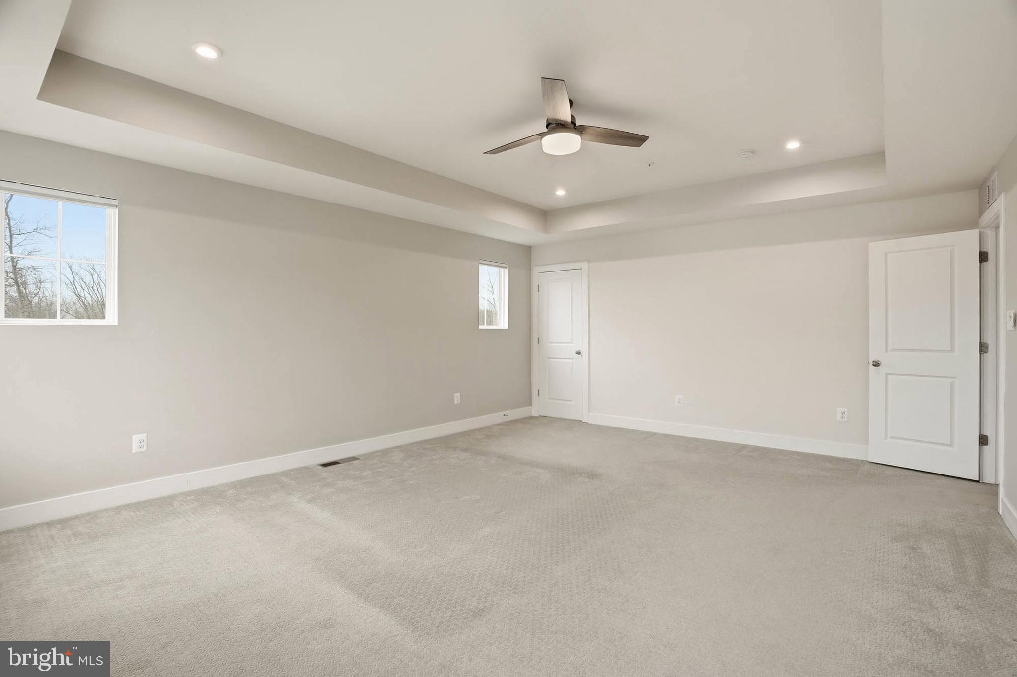 2305 Connor Circle Mount Airy, MD 21771 - Photo 23 of 44 an empty room with a ceiling fan and window
