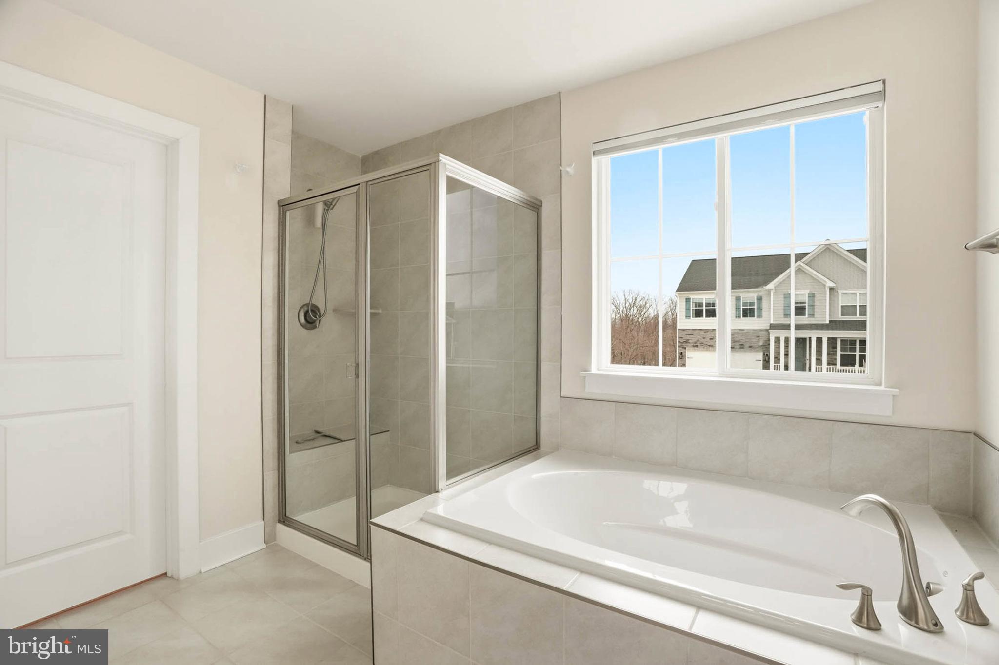 2305 Connor Circle Mount Airy, MD 21771 - Photo 25 of 44 a bathroom with a bathtub and shower