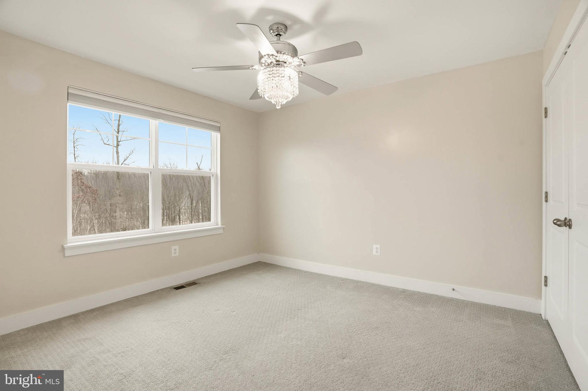 2305 Connor Circle Mount Airy, MD 21771 - Photo 26 of 44 an empty room with windows and fan