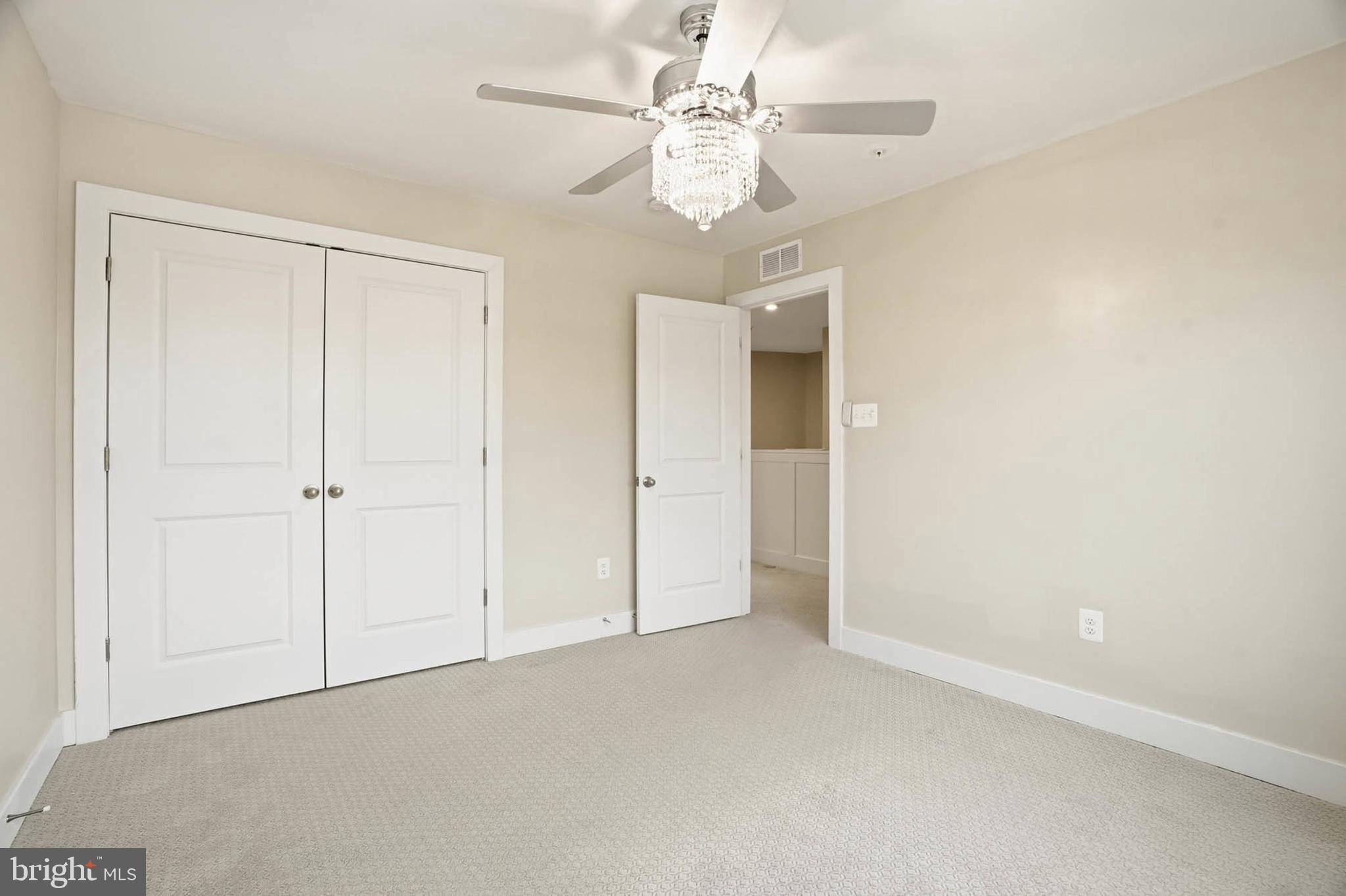 2305 Connor Circle Mount Airy, MD 21771 - Photo 27 of 44 an empty room with a ceiling fan and a window