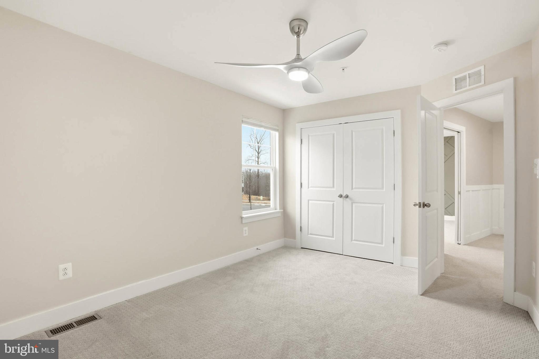 2305 Connor Circle Mount Airy, MD 21771 - Photo 28 of 44 an empty room with windows and fan