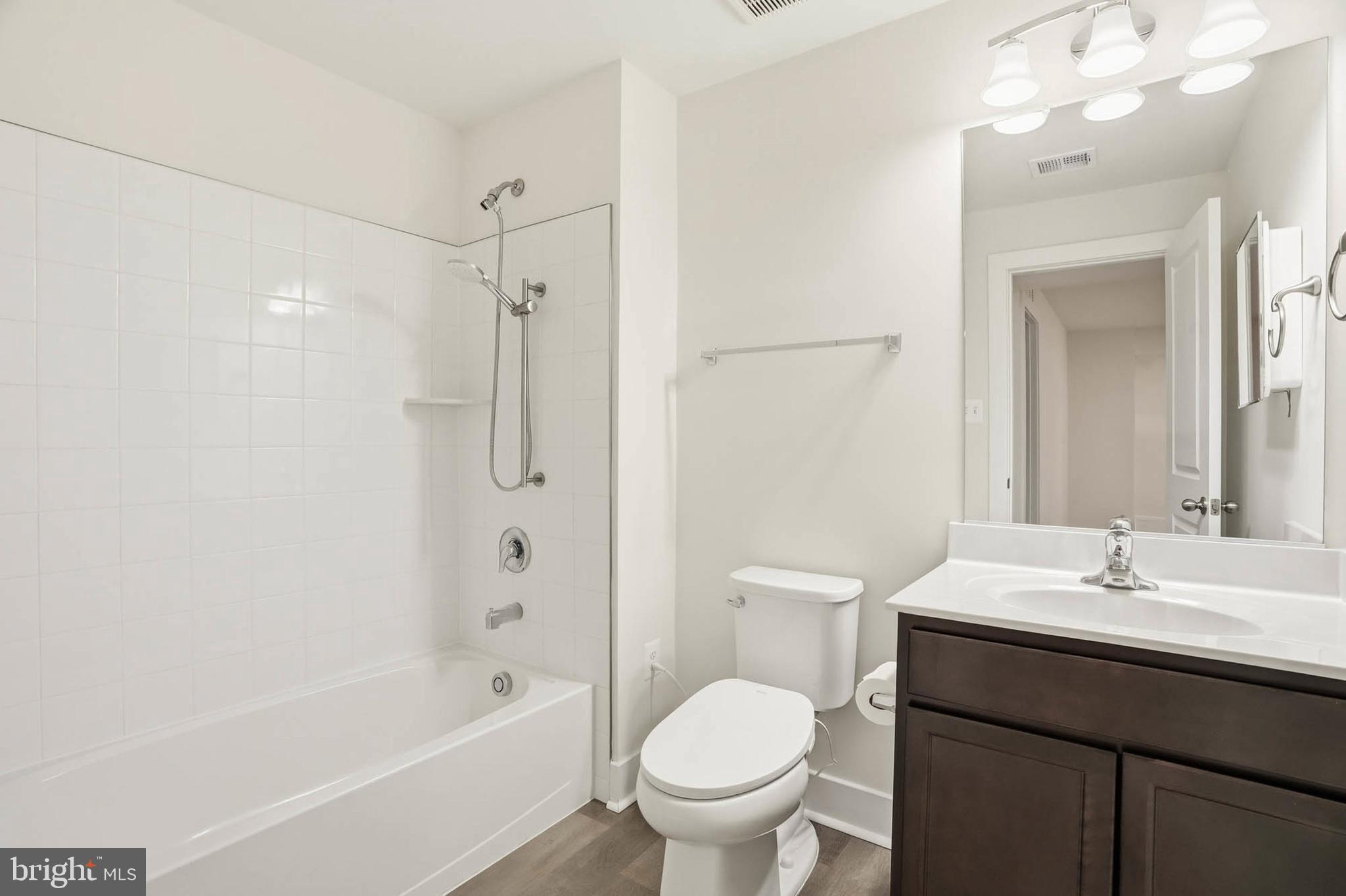 2305 Connor Circle Mount Airy, MD 21771 - Photo 37 of 44 a bathroom with a sink a toilet and shower