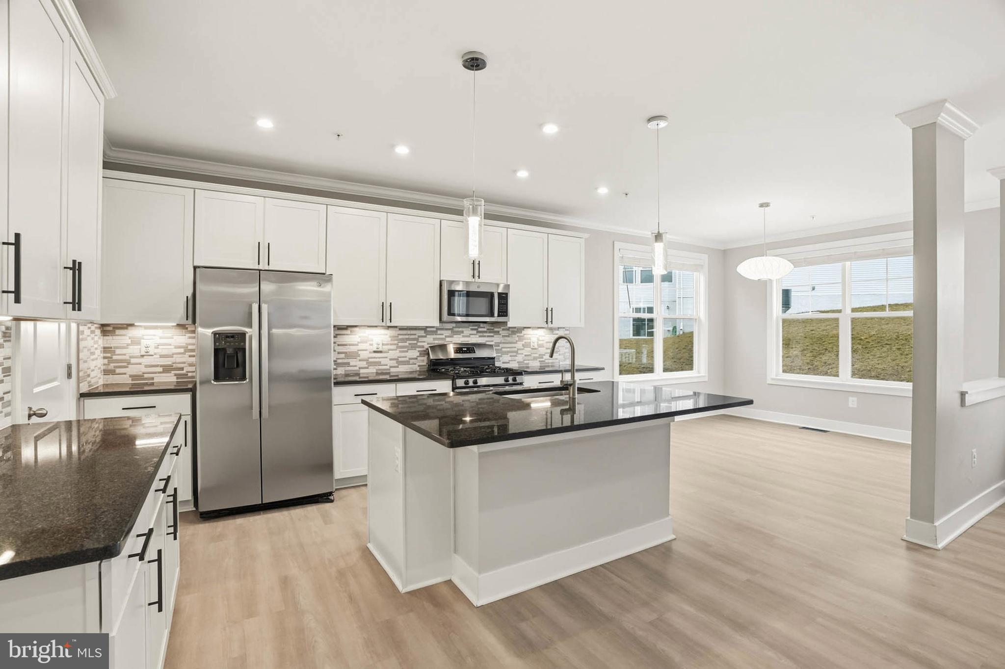 2305 Connor Circle Mount Airy, MD 21771 - Photo 5 of 44 a kitchen with stainless steel appliances granite countertop a stove a sink and a refrigerator