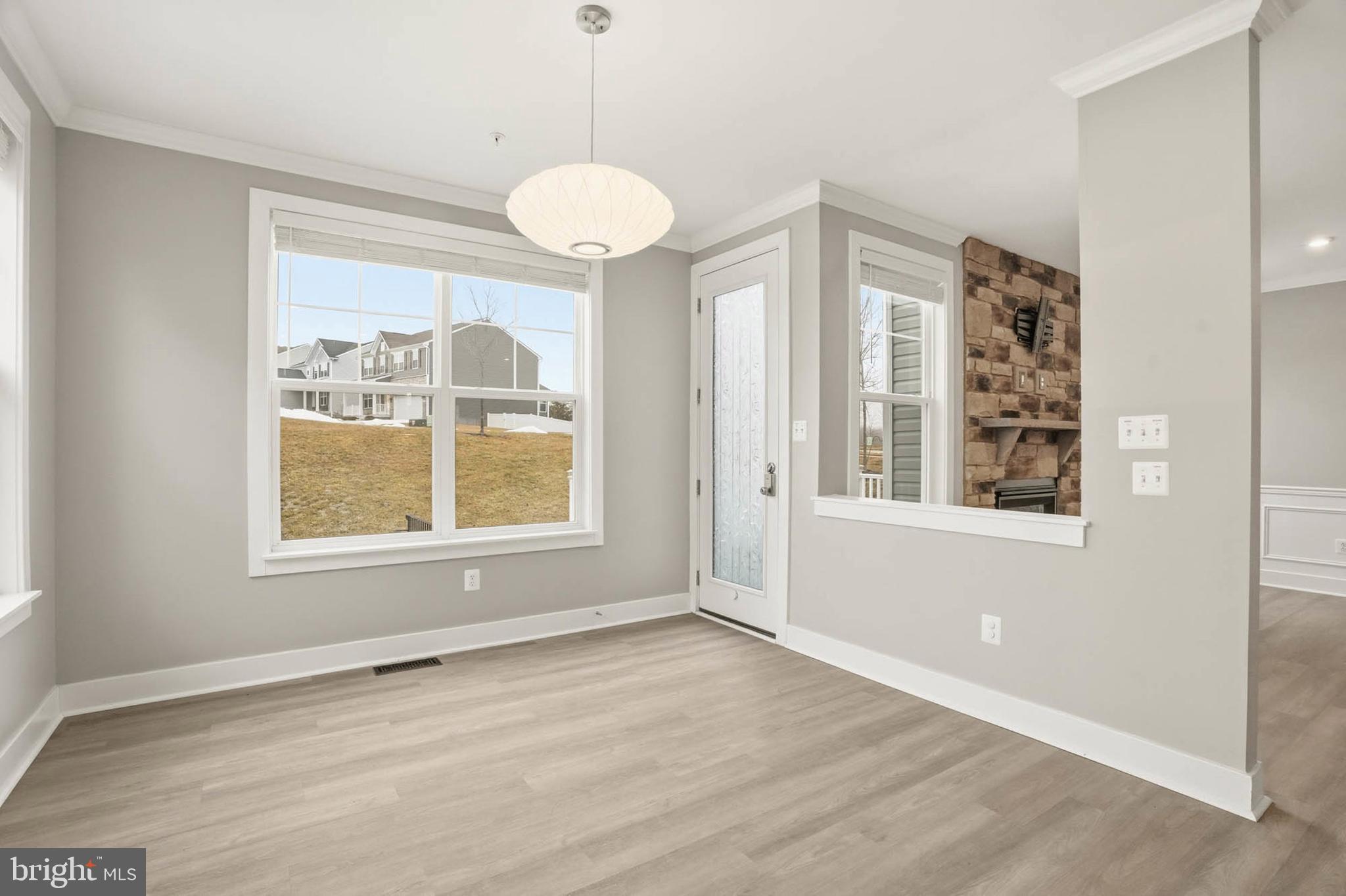 2305 Connor Circle Mount Airy, MD 21771 - Photo 10 of 44 an empty room with wooden floor and windows