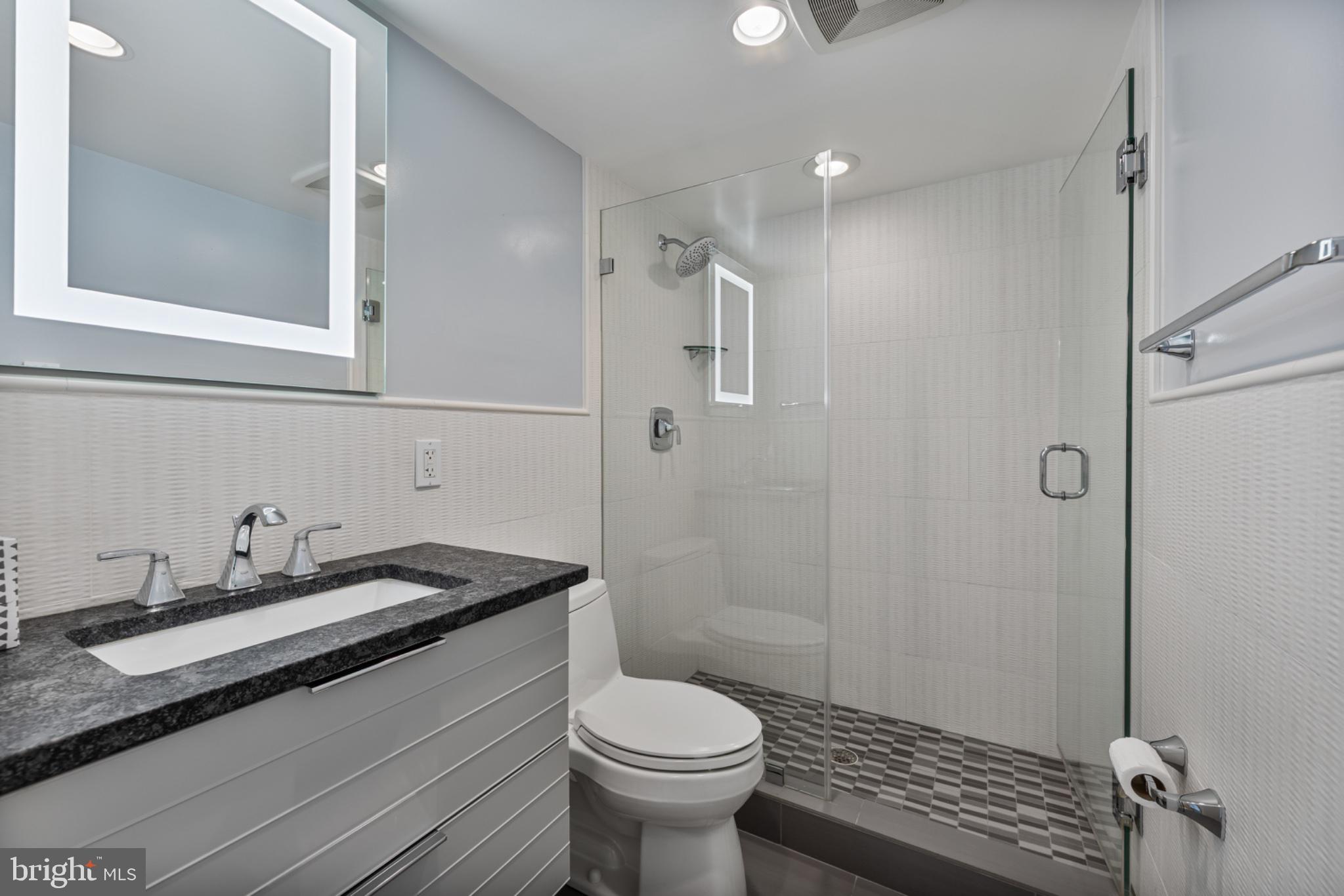 490 M Street Southwest, Unit W101 Washington, DC 20024 - Photo 12 of 25 Sleek modern bathroom oasis.