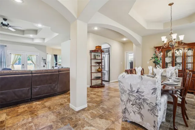 a view of a dining room and livingroom with furniture