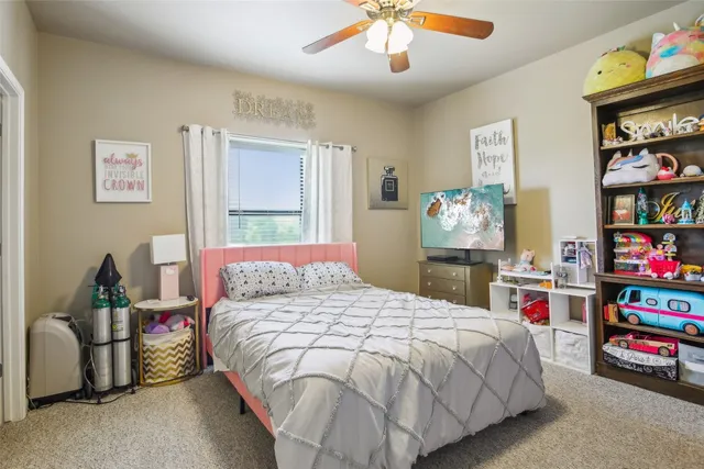 a bedroom with bed and a large bed