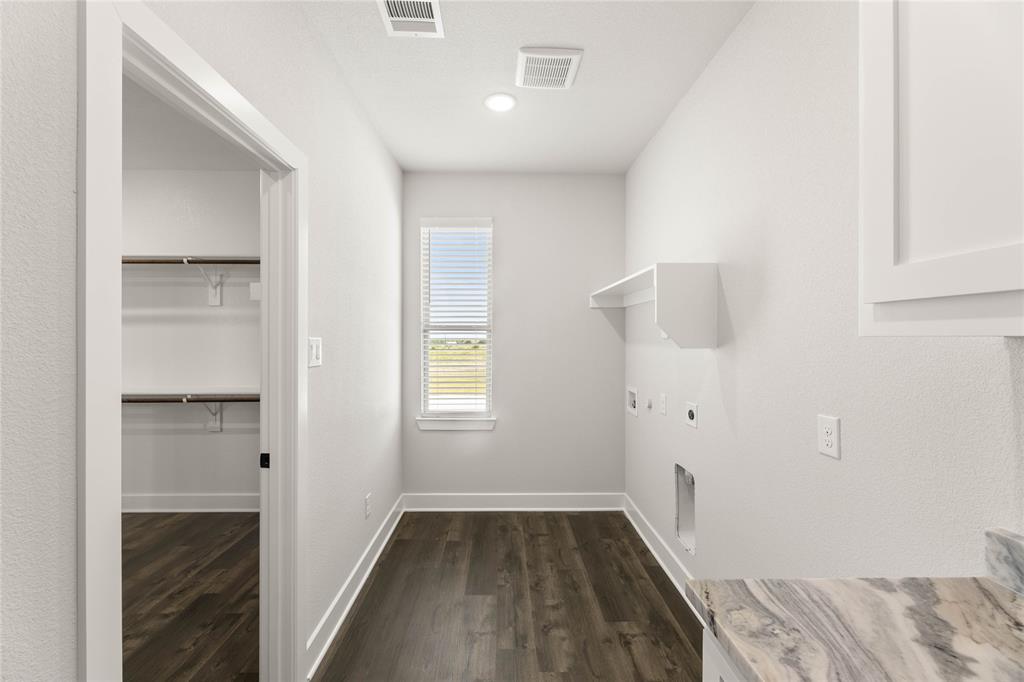 441 Collum View Azle, TX 76020 - Photo 23 of 38 Laundry room featuring dark wood finished floors, electric dryer hookup, and washer hookup
