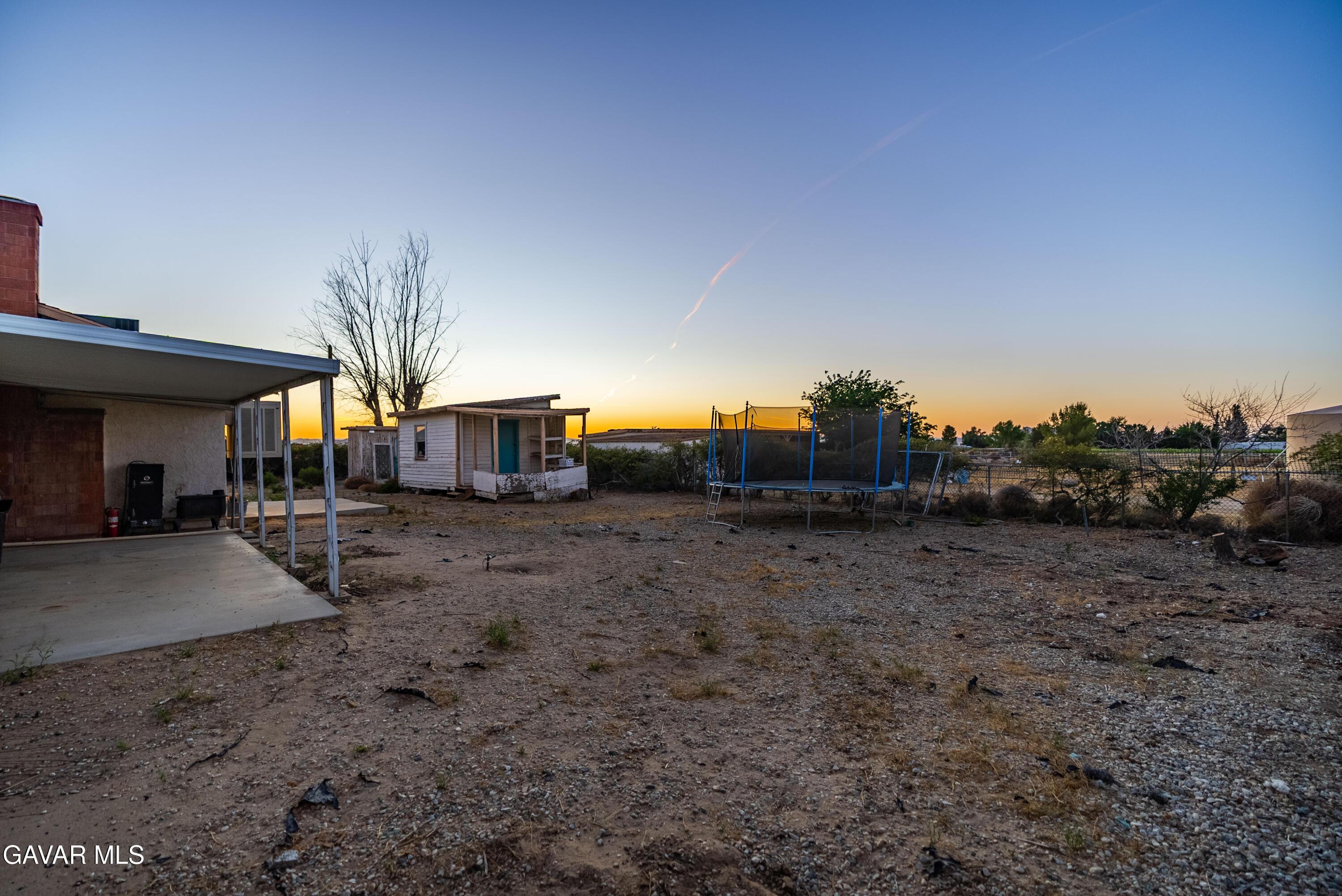 20539 East Ave R Palmdale, CA 93591 - Photo 34 of 55 a view of a house with a backyard