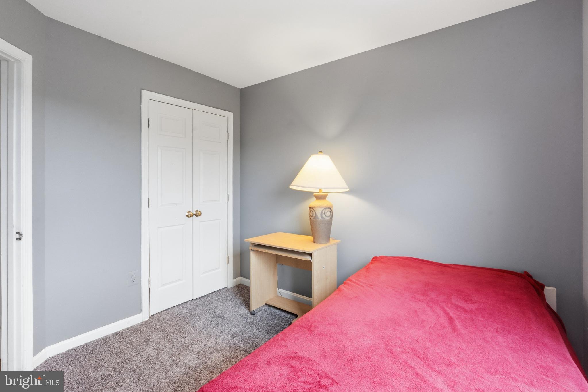 3132 Raking Leaf Drive Abingdon, MD 21009 - Photo 17 of 31 a bedroom with a bed and a lamp